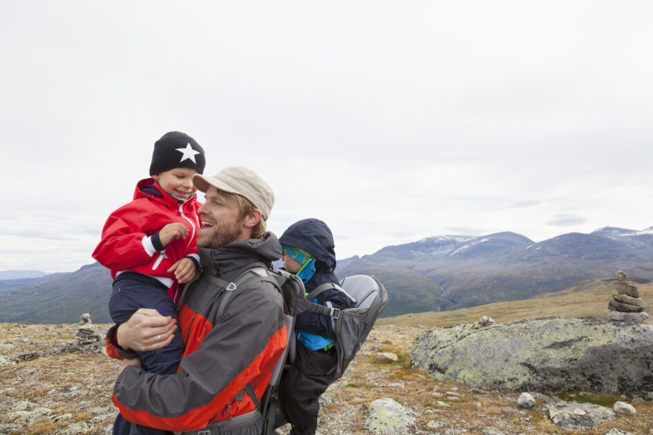 Male hiker with sons in mountain landscape, Jotunheimen National Park, Lom, Oppland, Norway